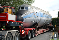 Fuselage passing through a narrow S bend at Hatch village.