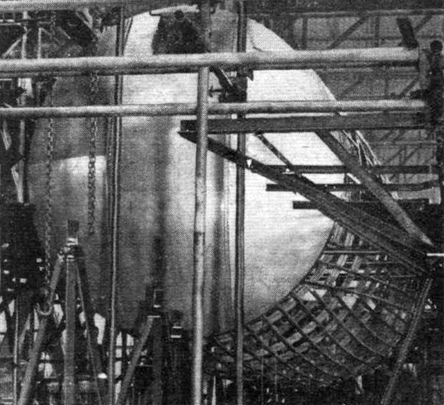 As may be seen from this photograph of the aft pressure bulkhead and fuselage, the first prototype is well under way.