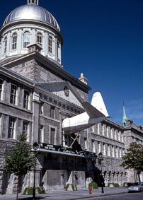 The nose and tail sections noted attached above the entrances to the Marche Bonsecours building, Montreal, Canada.