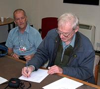 Paul St. John Turner signs the title transfer document