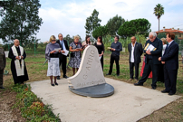 Relatives, friends and local officials gathered at the memorial stone to pay their respects.