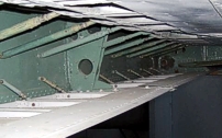 Photo of the re-attached the support stays that hold the upper and lower flap bay covers