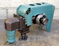A restored power drain valve in its mounting bracket.